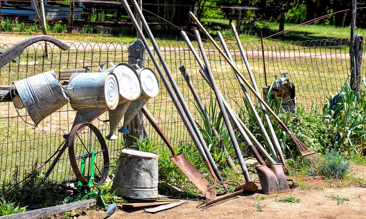 Gardening Tools on a Farm Fence